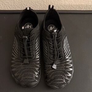 Black patterned, Hike Footwear. 
Uni sex 9/9.5 women…Men’s 7/7.5